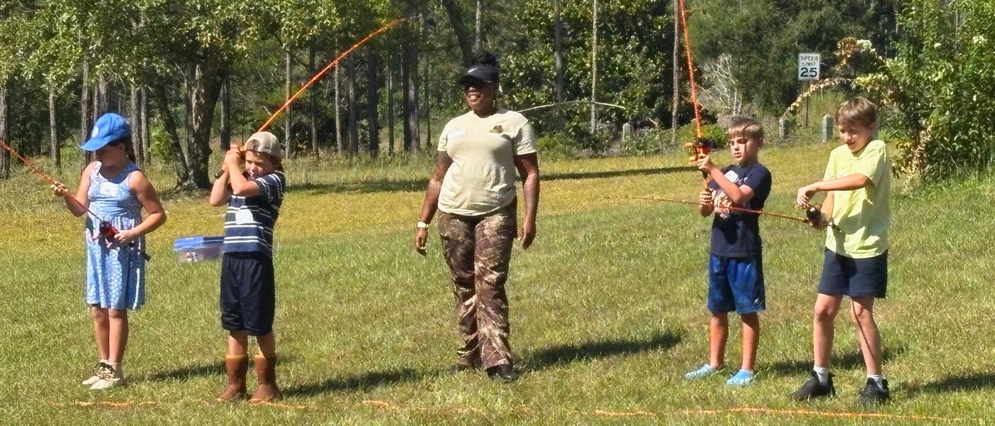 RHF instructor leading a casting practice clinic with youth participants in South Carolina