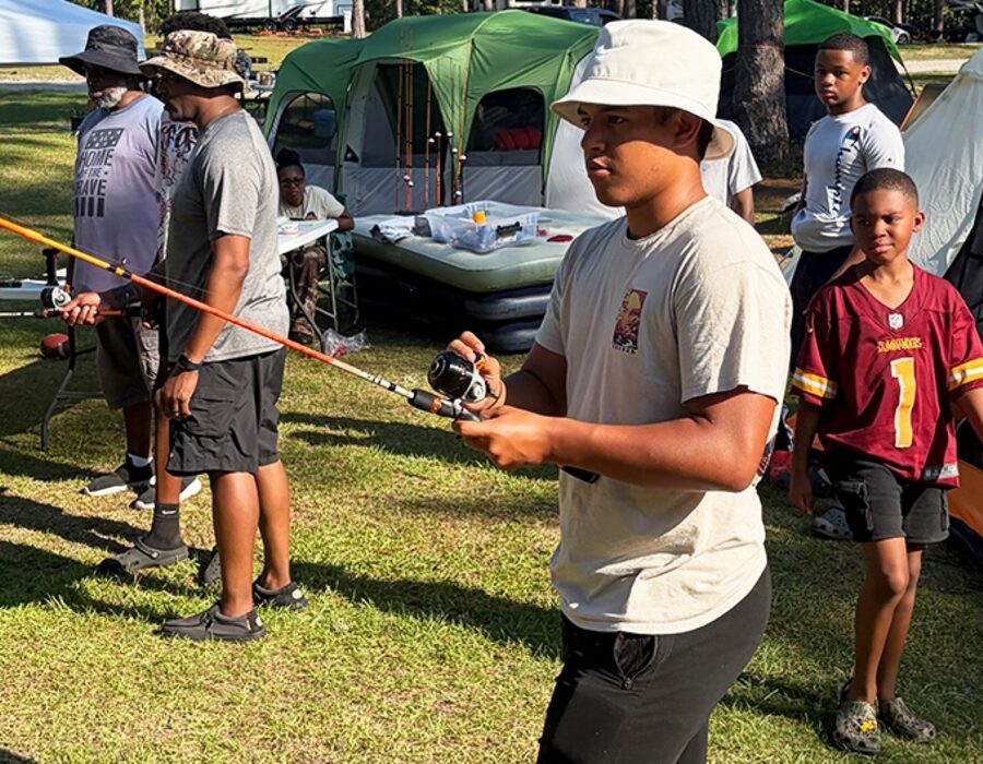 Teen participant practicing rod and reel technique at an RHF advanced fishing session